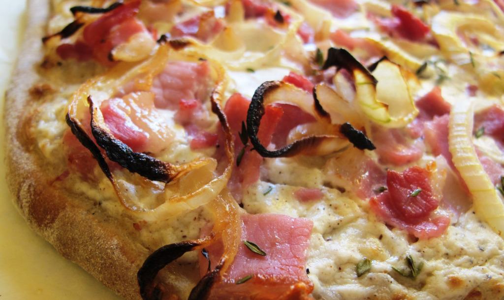 German Flammkuchen recipe using onions, sour cream, bacon